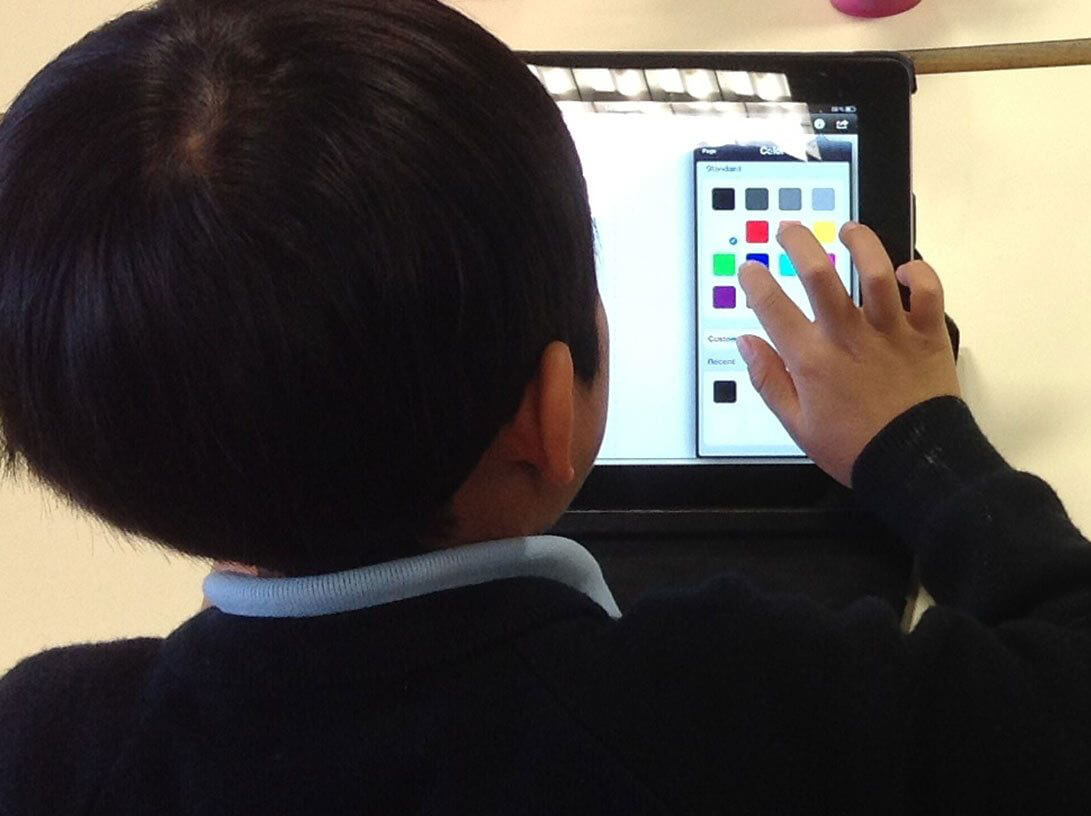 Boy using Book Creator